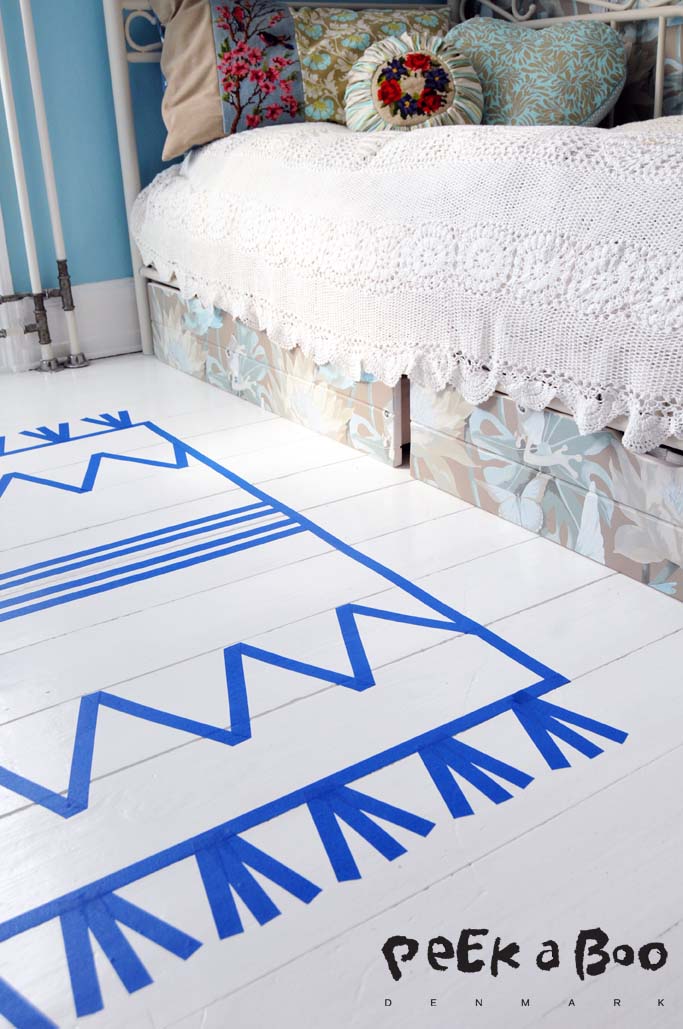 masking tape carpet that's easy to change and make new designs.