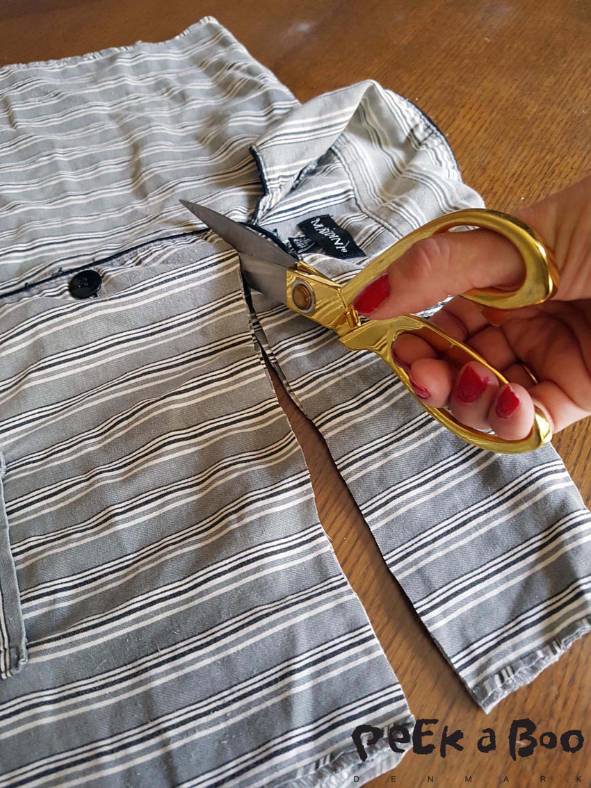 Then you cut off the upper part of the shirt. to mid of the sleeve opening.